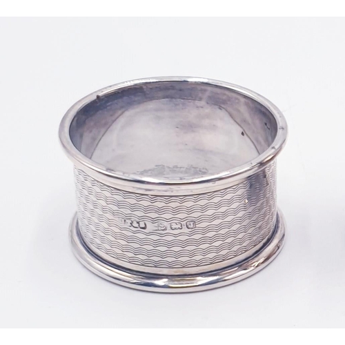 70 - SILVER (Hallmarked) NAPKIN RING TOGETHER WITH A SILVER PLATED PEPPER POT