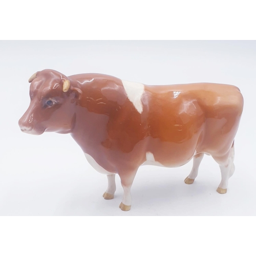 193 - BESWICK 11.9cm MODEL OF A GUERNSEY BULL 