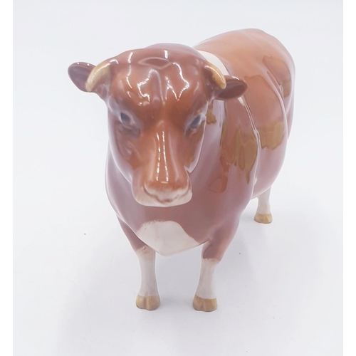 193 - BESWICK 11.9cm MODEL OF A GUERNSEY BULL 