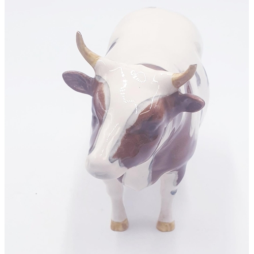 194 - BESWICK 13.3cm MODEL OF AN AYRSHIRE BULL 