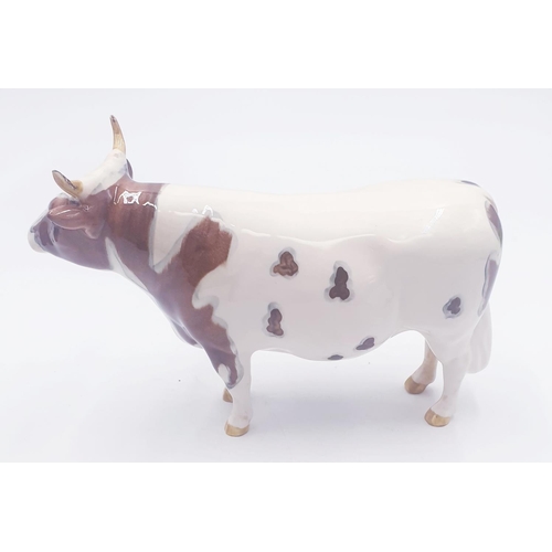 194 - BESWICK 13.3cm MODEL OF AN AYRSHIRE BULL 