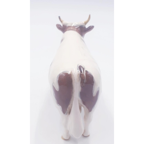 194 - BESWICK 13.3cm MODEL OF AN AYRSHIRE BULL 