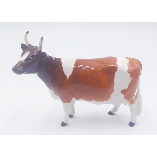 195 - BESWICK 12.7cm MODEL OF AN AYRSHIRE COW 