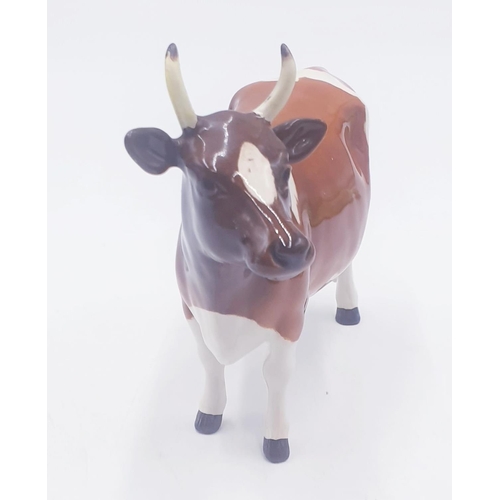 195 - BESWICK 12.7cm MODEL OF AN AYRSHIRE COW 