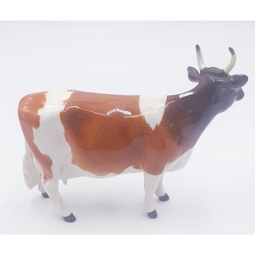 195 - BESWICK 12.7cm MODEL OF AN AYRSHIRE COW 