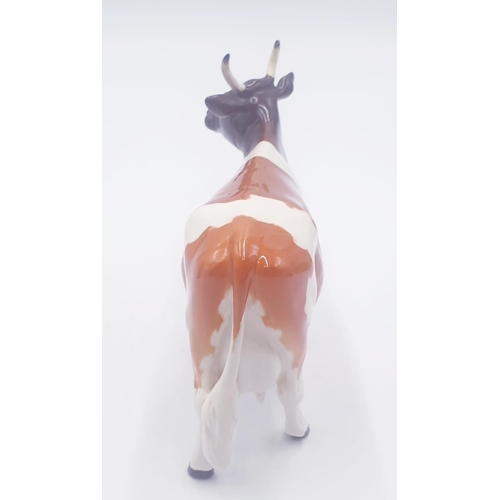 195 - BESWICK 12.7cm MODEL OF AN AYRSHIRE COW 