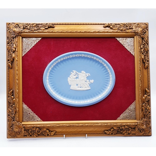 744 - WEDGWOOD BLUE JASPER WARE PLAQUE MOUNTED IN A 41cm x 51cm GOLD FRAME.
(Please Note This Lot WILL NOT... 