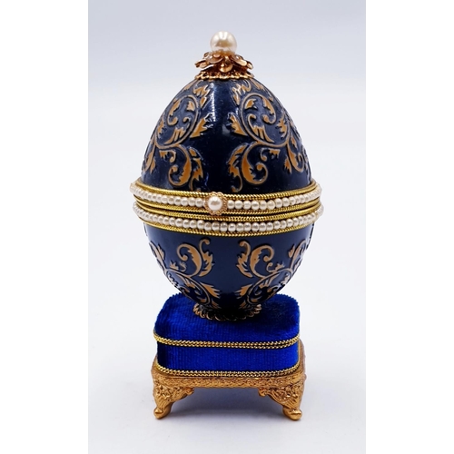 752 - ENAMEL EGG SHAPED MUSICAL RING BOX