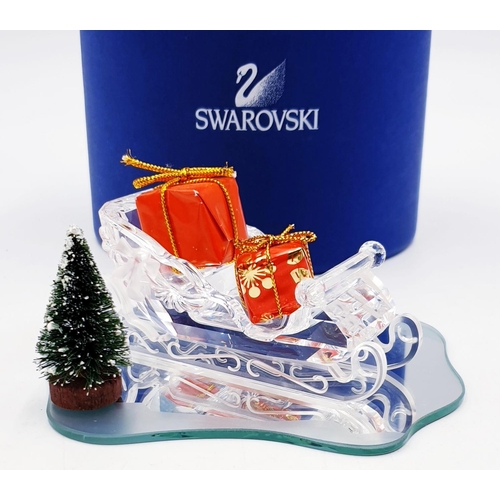 784 - SWAROVSKI CRYSTAL 10.5cm SLEIGH (This retired Swarovski crystal sleigh was part of the “Exquisite Ac... 