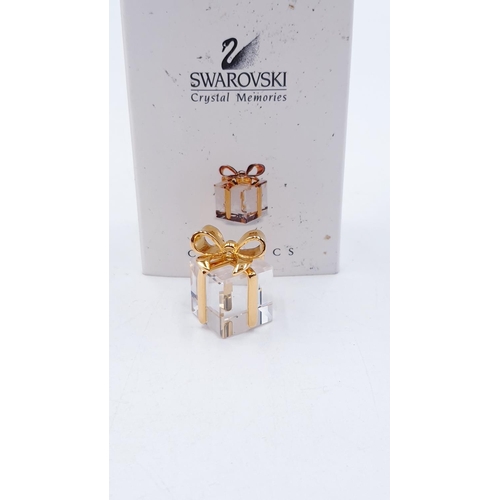 796 - SWAROVSKI CRYSTAL MEMORIES PRESENT (This retired Swarovski Crystal Memories present with gold metal ... 