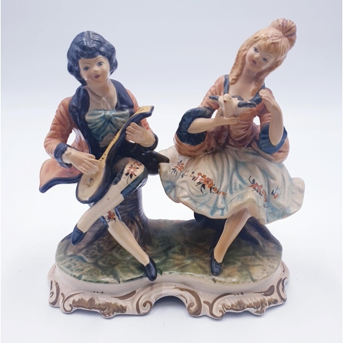 309 - ITALIAN 24cm x 24cm FIGURINE  OF A COUPLE SAT TOGETHER