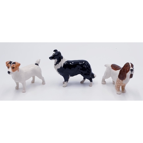 697 - BESWICK MODELS OF THREE DOGS 