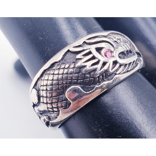 716 - STERLING SILVER (925) GENTS DRAGON RUBY EYE BAND RING (Size U-V, Total Weight 5.1 Grams)