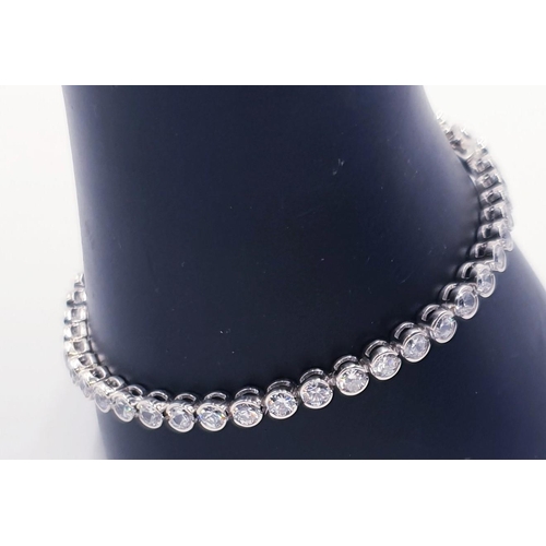 718 - STERLING SILVER (Fully Hallmarked) /CUBIC ZIRCONIA 19cm TENNIS BRACELET (Total Weight 10.35 Grams)