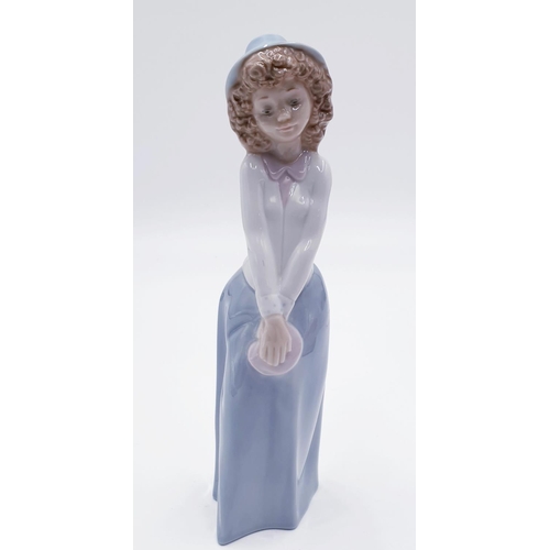 752A - LLADRO (Nao) PORCELAIN Large 24cm CHARACTER FIGURINE OF A YOUNG GIRL WITH HAT AND HOLDING A PINK PUR... 