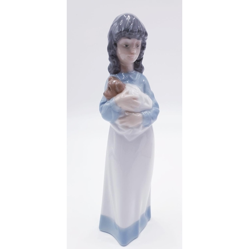 753 - LLADRO (Nao) PORCELAIN 23cm CHARACTER FIGURINE OF A YOUNG GIRL HOLDING HER PUPPY 