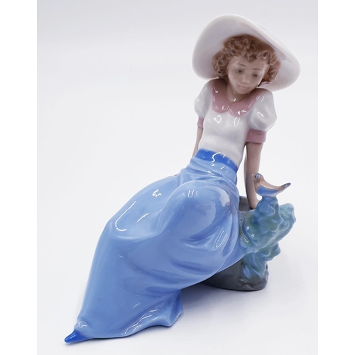 758 - LLADRO (Nao) PORCELAIN Large 15cm x 15cm CHARACTER OF A YOUNG GIRL LEANING AGAINST ROCKS With BIRD 