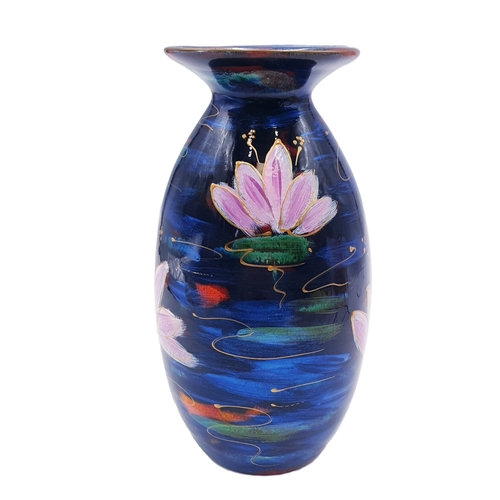 607 - ANITA HARRIS ART POTTERY 21cm MINOS VASE IN THE LOTUS FLOWER DESIGN (Signed In Gold By Anita Harris)