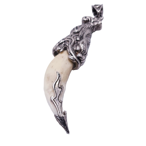 577 - WHITE METAL TOOTH PENDANT