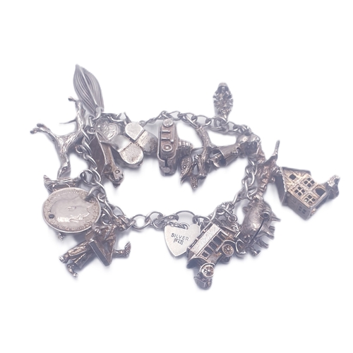 168 - SILVER (Stamped) CHARM BRACELET (Complete With 18 CHARMS) (Total Weight 49.6 Grams)