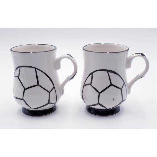 533 - ANITA HARRIS ART POTTERY FOOTBALL MUGS (2) (Crazed)