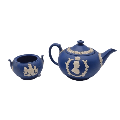 732 - WEDGWOOD DARK BLUE JASPER WARE TEAPOT & SUGAR BOWL.