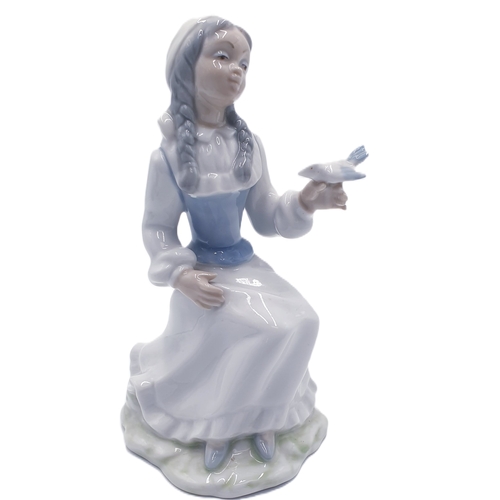 117 - TENGRA PORCELAIN (Spain) Large 21cm CHARACTER FIGURINE OF A GIRL With PIGTAILS WITH BIRD ON HAND