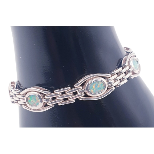 65B - SOLID SILVER (Fully Hallmarked For Birmingham) 18.5 cm SEVEN STONE SET OPAL BRACELET (Total Weight 1... 