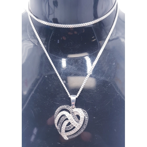 725 - STERLING SILVER (T.G.G.C.) / BLACK/WHITE STONE SET HEART PENDANT ON A STERLING SILVER 40cm NECK CHAI... 