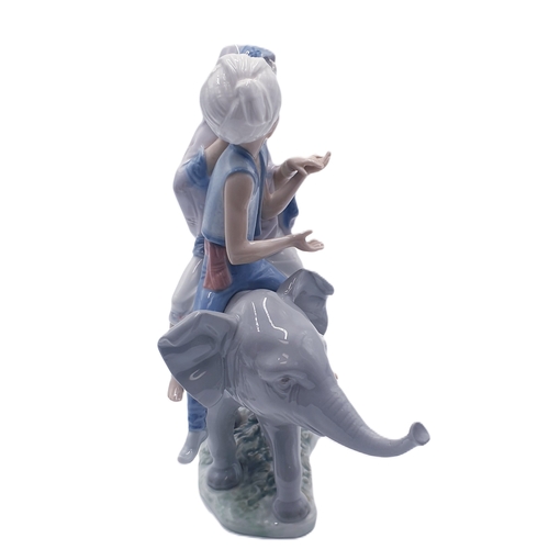 546 - LLADRO PORCELAIN Large 23cm x 19cm x 11.5cm MODEL OF TWO HINDU CHILDREN SITTING ON AN ELEPHANT (Mode... 