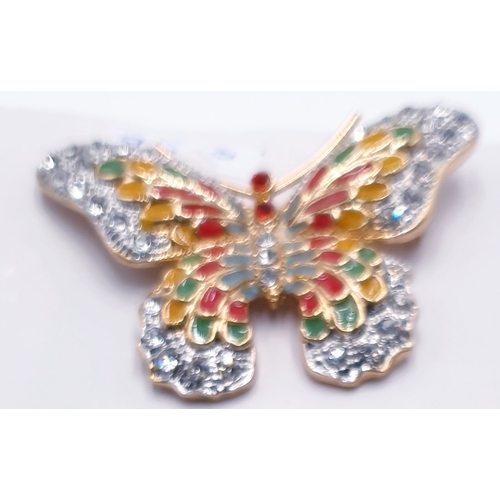 194 - WHITE METAL BROOCH FASHIONED AS A BUTTERFLY