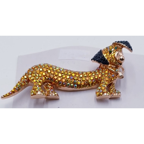 196 - WHITE METAL BROOCH FASHIONED AS A DACHSHUND