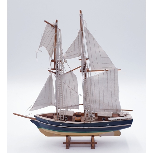 692 - WOODEN Large 31cm x 28cm MODEL OF A YACHT IN FULL SAIL