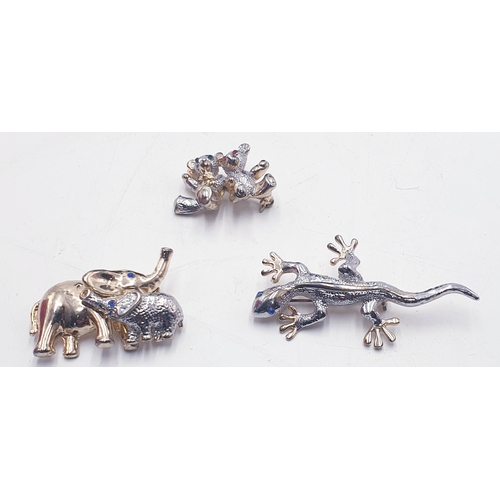 58 - WHITE METAL BROOCHES (3)