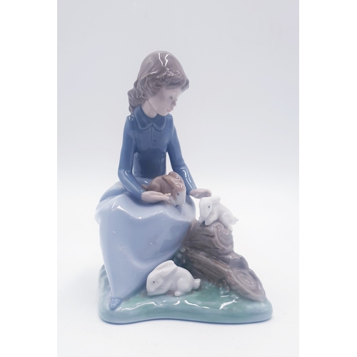 117 - LLADRO (Nao) PORCELAIN Large 17cm x 15cm CHARACTER FIGURINE OF A YOUNG GIRL WITH RABBITS Issued 1992... 