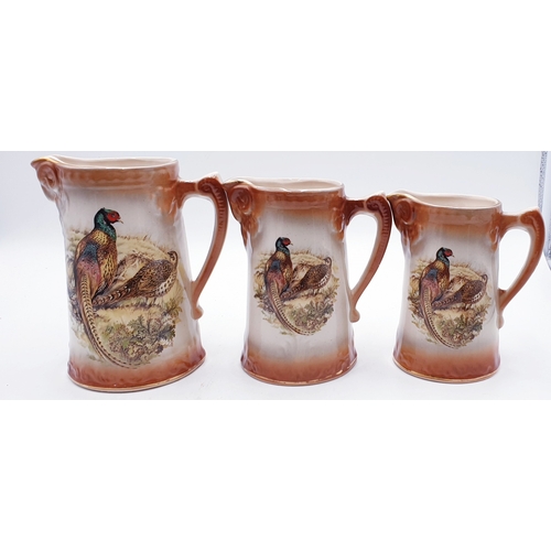 744 - CERAMIC GRADUATED  JUGS  (3) (Tallest Being 20cm)