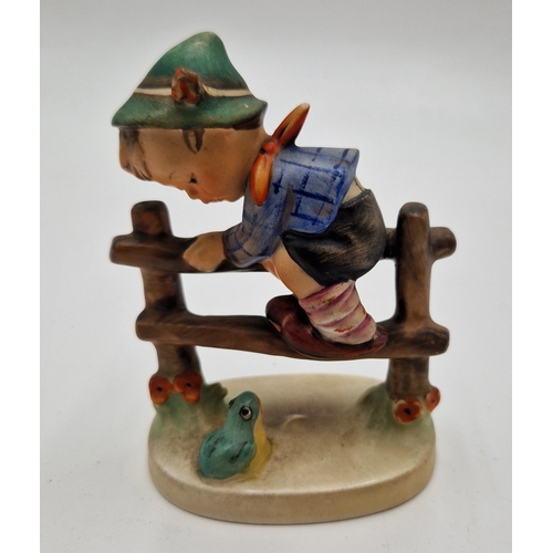 50 - GOEBEL/HUMMEL PORCELAIN 10cm CHARACTER FIGURINE OF A YOUNG BOY CLIMBING FENCE