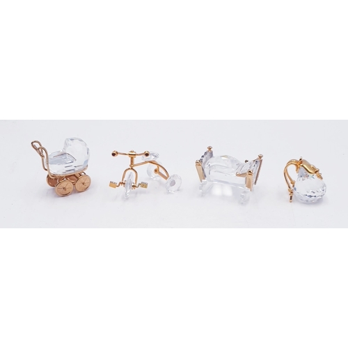 102 - SWAROVSKI CRYSTAL MEMORIE ITEMS (4) INC TRICYCLE, PRAM, CRIB & BACKPACK