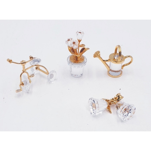 103 - SWAROVSKI CRYSTAL MEMORIES ITEMS (4) INC BELL, WATERING CAN, FLOWERS, Etc