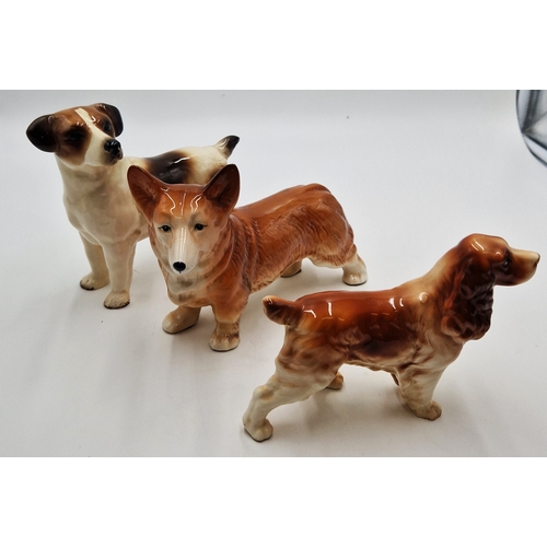 586 - POTTERY MODELS OF THREE DOGS