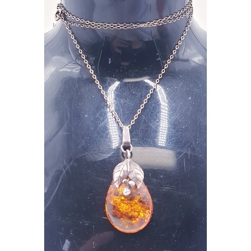 85 - STERLING SILVER  / AMBER PENDANT ON A SILVER  50cm NECK CHAIN (Total Weight 5.1 Grams)