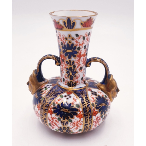 485 - ROYAL CROWN DERBY CHINA TWIN HANDLED VASE IN THE IMARI DESIGN