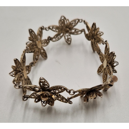 415 - WHITE METAL FILLIGREE FLOWER DESIGN BRACELET