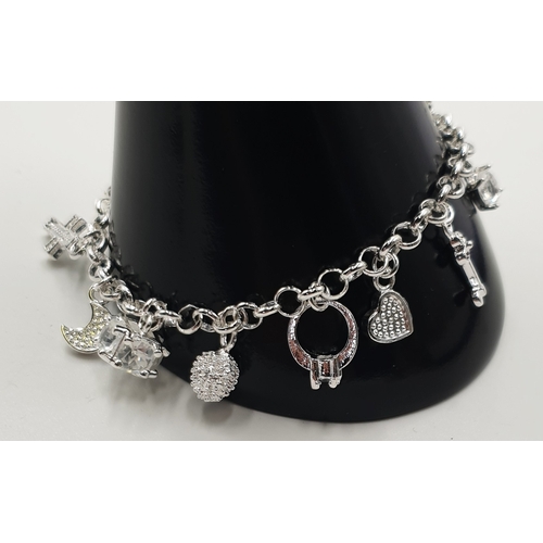 138A - SILVER (Stamped 925) 21cm CHARM BRACELET With 12 CHARMS To Include RINGS,MOON,HEART,KEY , STAR ,Etc ... 