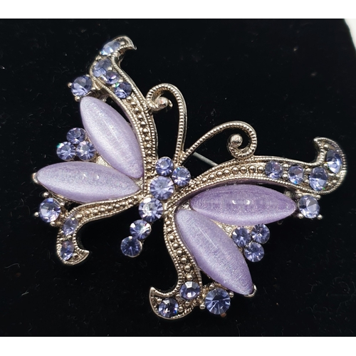 132 - WHITE METAL & MARCASITE STONE SET BROOCH FASHIONED AS A BUTTERFLY