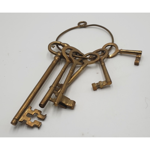 702 - BRASS SET OF SIX KEYS