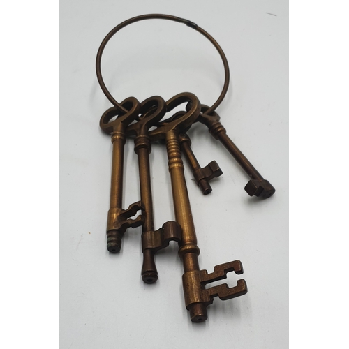 703 - BRASS SET OF FIVE KEYS