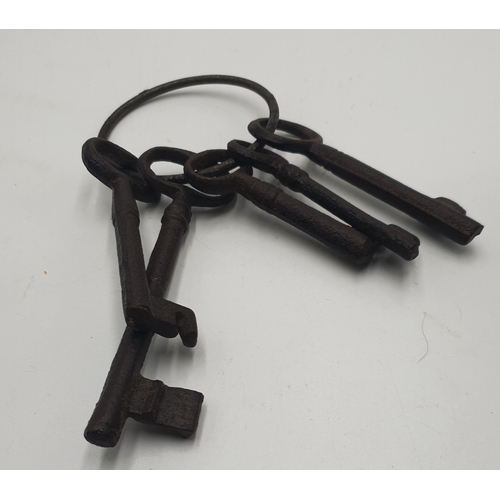 704 - CAST IRON SET OF FIVE KEYS