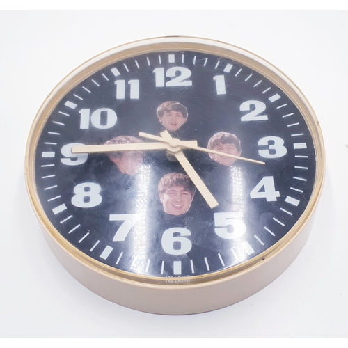 56 - PLASTIC 20 cm Dia CIRCULAR QUARTZ WALL CLOCK FEATURING THE BEATLES