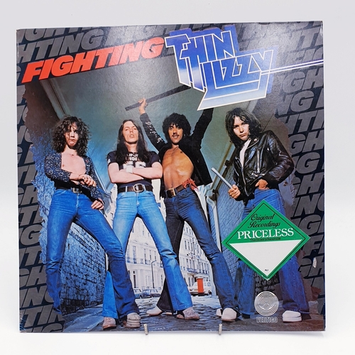 61 - THIN LIZZY VINYL ALBUMS (4)
(Three UK issues Plus One German issue). Fighting (Nice Price reissue), ... 